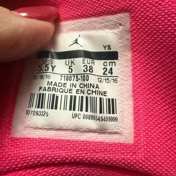 Kids Jordan White and Pink Sneakers